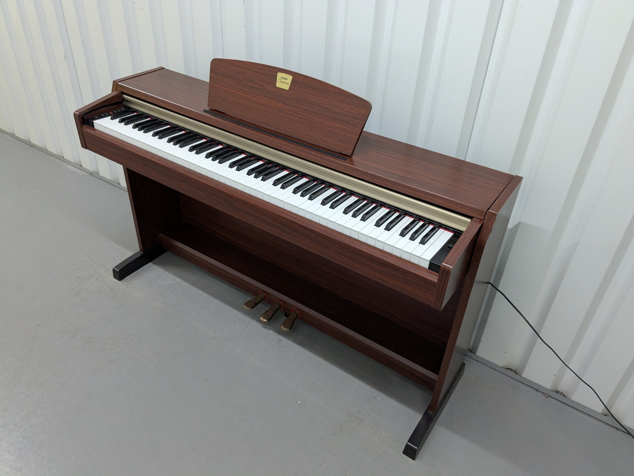 Yamaha Clavinova CLP-220 digital piano in mahogany finish stock