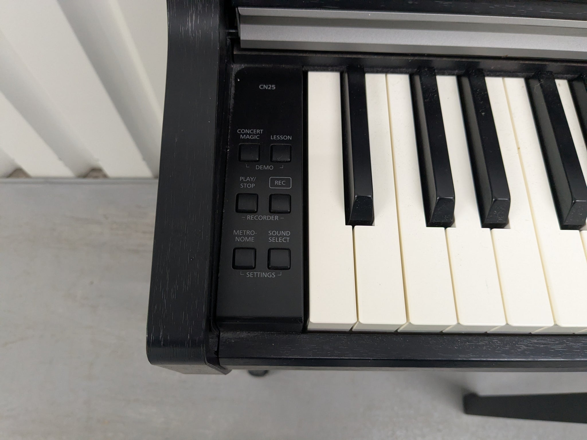 Kawai CN25 digital piano and stool In satin black stock #25159