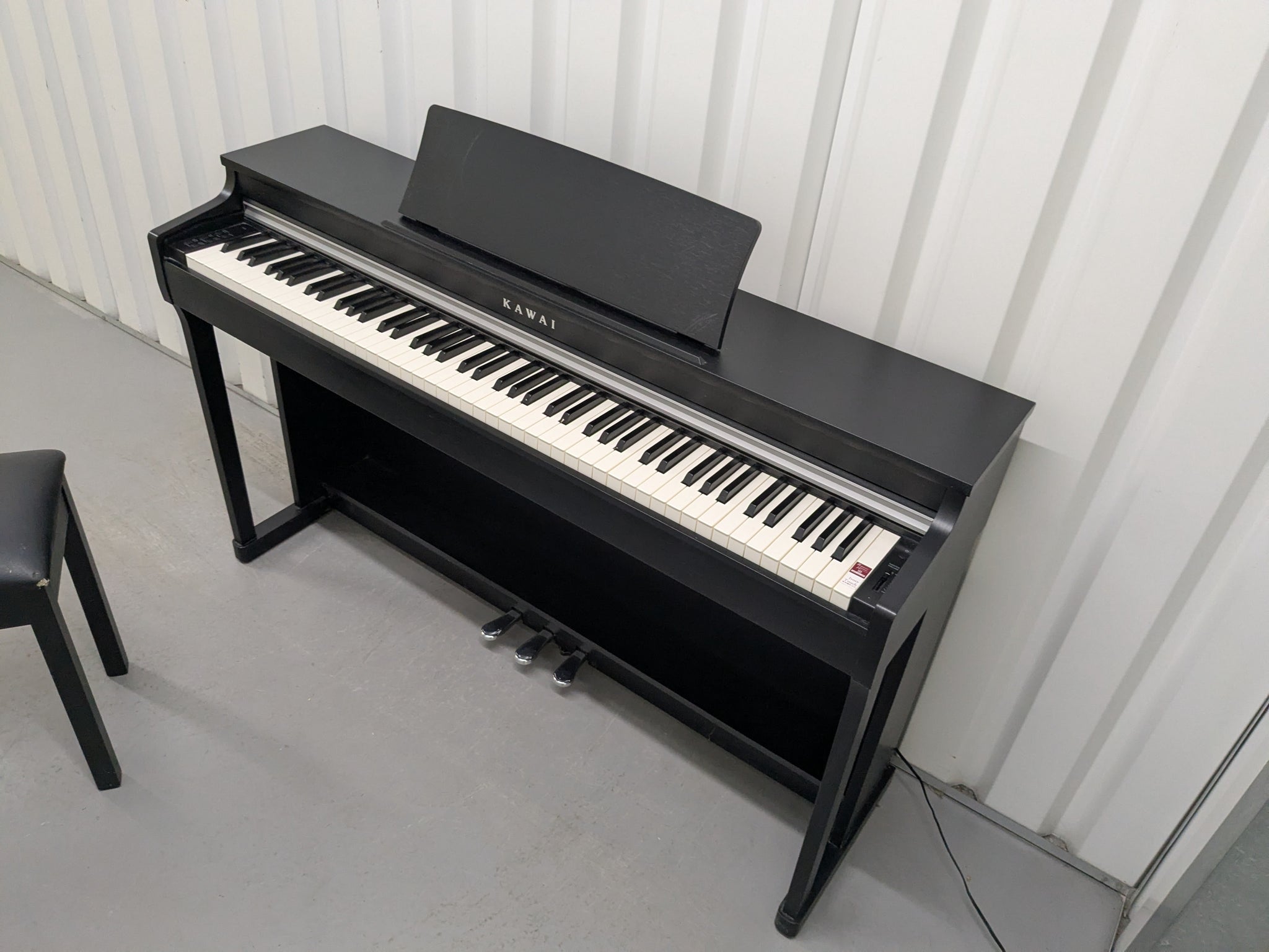 Kawai CN25 digital piano and stool In satin black stock #25159
