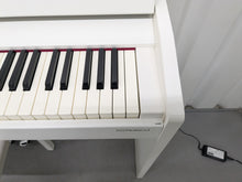 Load image into Gallery viewer, Roland F140R Digital Piano in satin white slim line space saver stock # 25230
