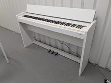 Load image into Gallery viewer, Roland F140R Digital Piano in satin white slim line space saver stock # 25230
