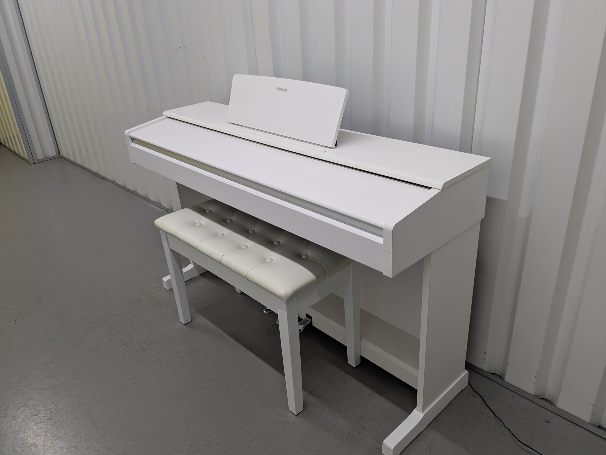 Yamaha Arius YDP-145 digital piano and stool in satin white finish