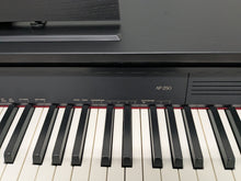 Load image into Gallery viewer, Casio Celviano AP-250 digital piano and stool in satin black finish stock number 25286
