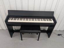 Load image into Gallery viewer, Roland F140R Digital Piano in satin black slim line space saver stock # 25303
