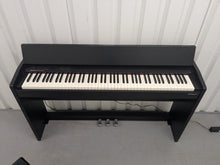 Load image into Gallery viewer, Roland F140R Digital Piano in satin black slim line space saver stock # 25303
