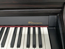 Load image into Gallery viewer, Roland HP-2e digital piano and stool in dark rosewood finish stock number 25317
