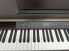 Load image into Gallery viewer, Yamaha Clavinova CLP-120 Digital Piano in dark rosewood stock #25305
