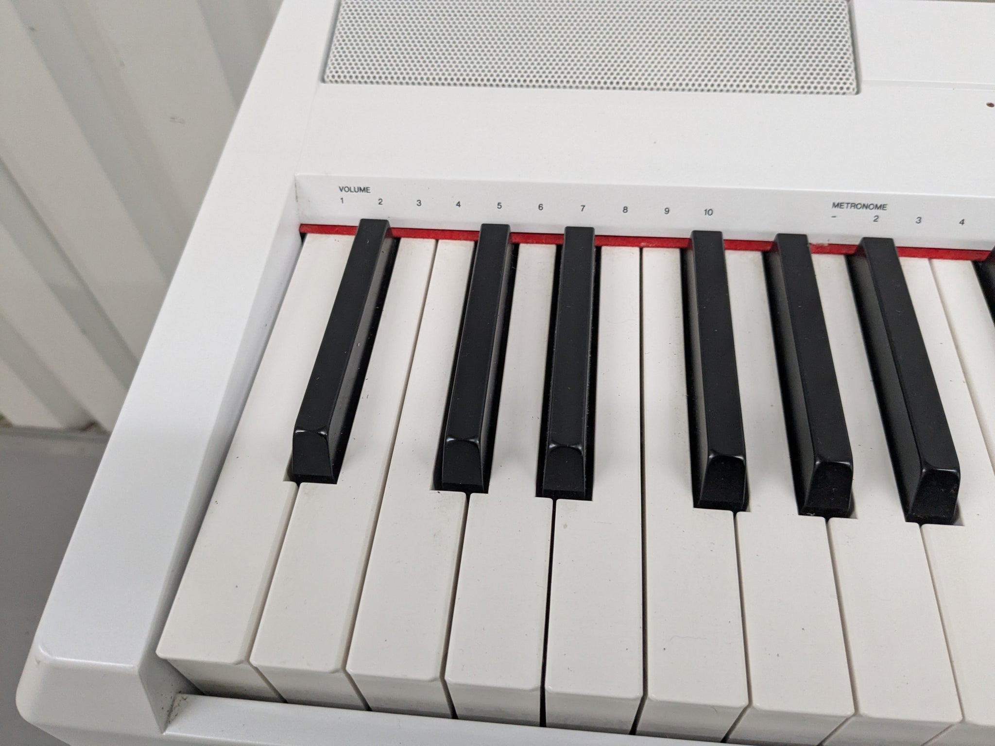 Yamaha P-115 digital portable piano with collapsible stand and