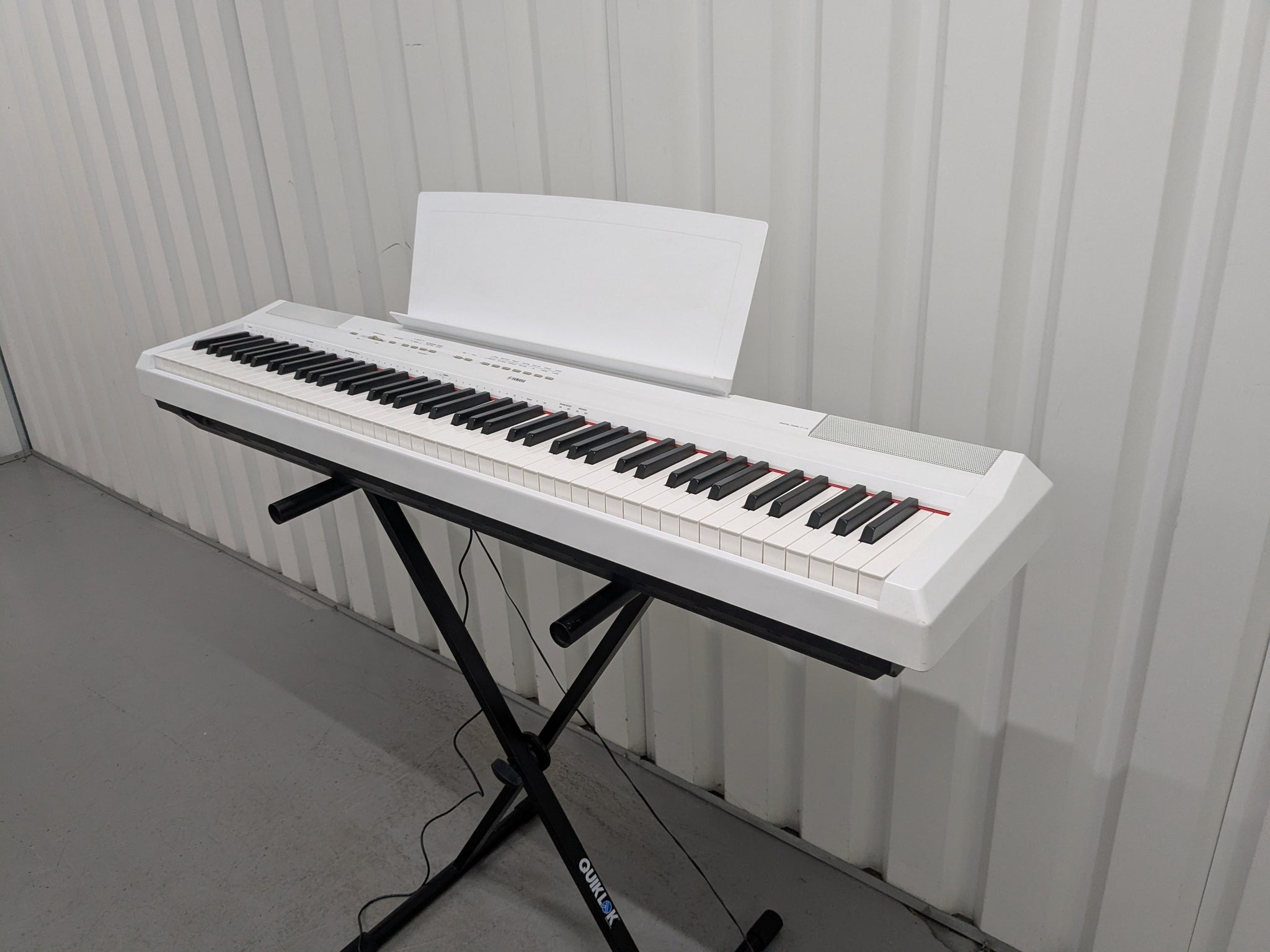 Yamaha P-115 digital portable piano with collapsible stand and