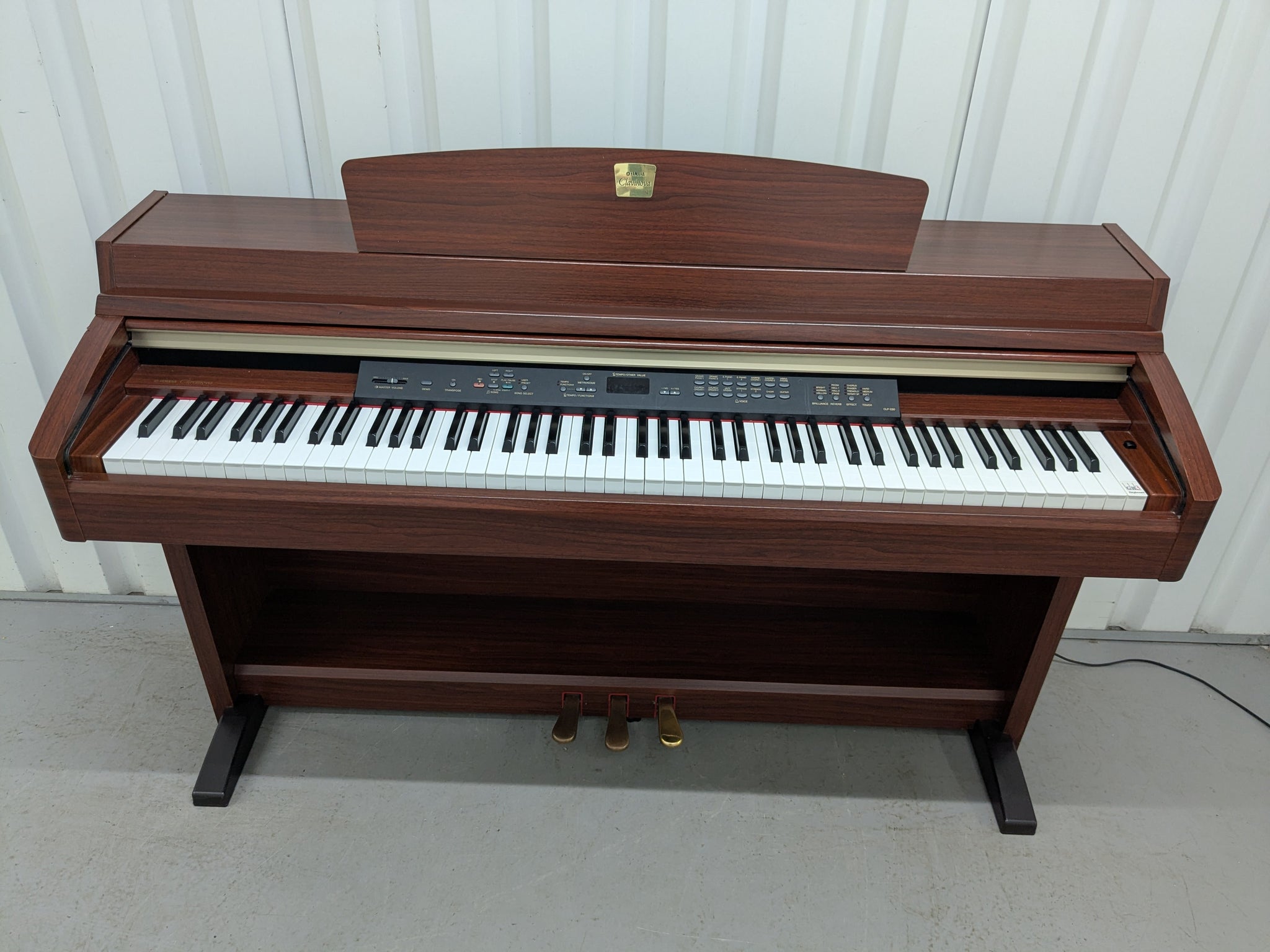 Yamaha Clavinova CLP-230 digital piano in mahogany finish stock