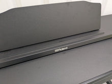 Load image into Gallery viewer, Roland RP102 digital piano in satin black finish stock number 25333
