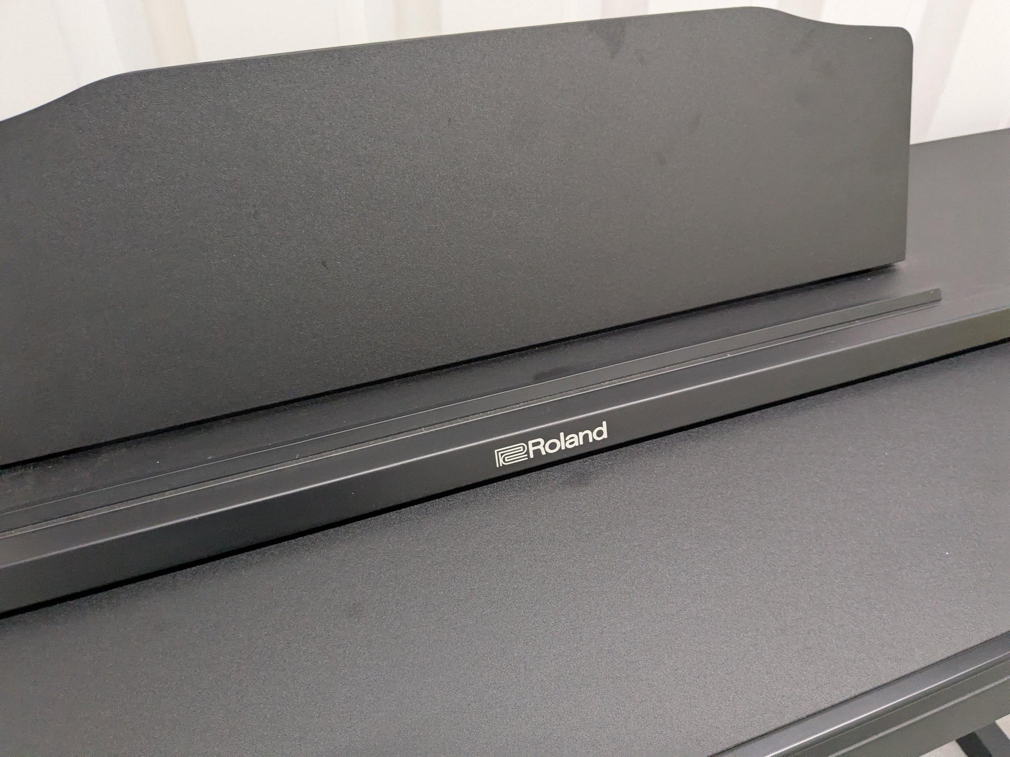 Roland RP102 digital piano in satin black finish stock number