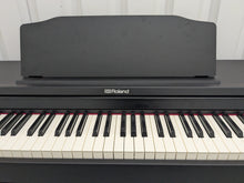 Load image into Gallery viewer, Roland RP102 digital piano in satin black finish stock number 25333
