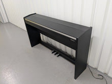 Load image into Gallery viewer, Roland F140R Digital Piano in satin black slim line space saver stock # 25351
