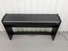 Load image into Gallery viewer, Roland F140R Digital Piano in satin black slim line space saver stock # 25351
