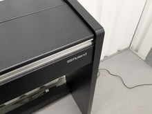 Load image into Gallery viewer, Roland F140R Digital Piano in satin black slim line space saver stock # 25351
