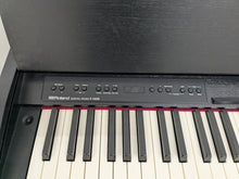 Load image into Gallery viewer, Roland F140R Digital Piano in satin black slim line space saver stock # 25351
