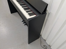 Load image into Gallery viewer, Roland F140R Digital Piano in satin black slim line space saver stock # 25351
