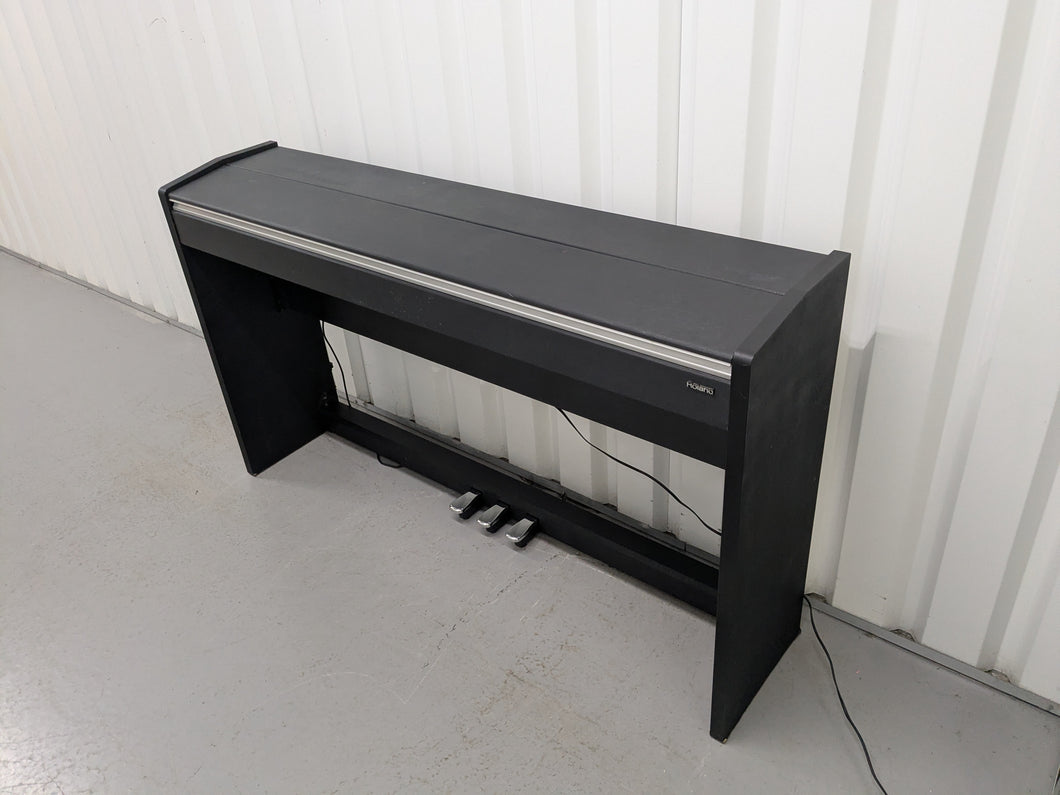 Roland F110 compact slim size Digital Piano in black  stock # 25364