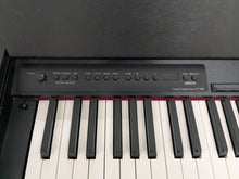 Load image into Gallery viewer, Roland F110 compact slim size Digital Piano in black  stock # 25364
