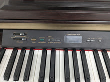 Load image into Gallery viewer, Yamaha Clavinova CLP-120 Digital Piano in dark rosewood stock #25348
