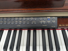 Load image into Gallery viewer, Yamaha Clavinova CLP-170 digital piano in mahogany stock #25363
