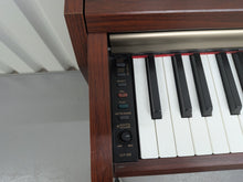 Load image into Gallery viewer, Yamaha Clavinova CLP-220 digital piano and stool in mahogany stock #25427
