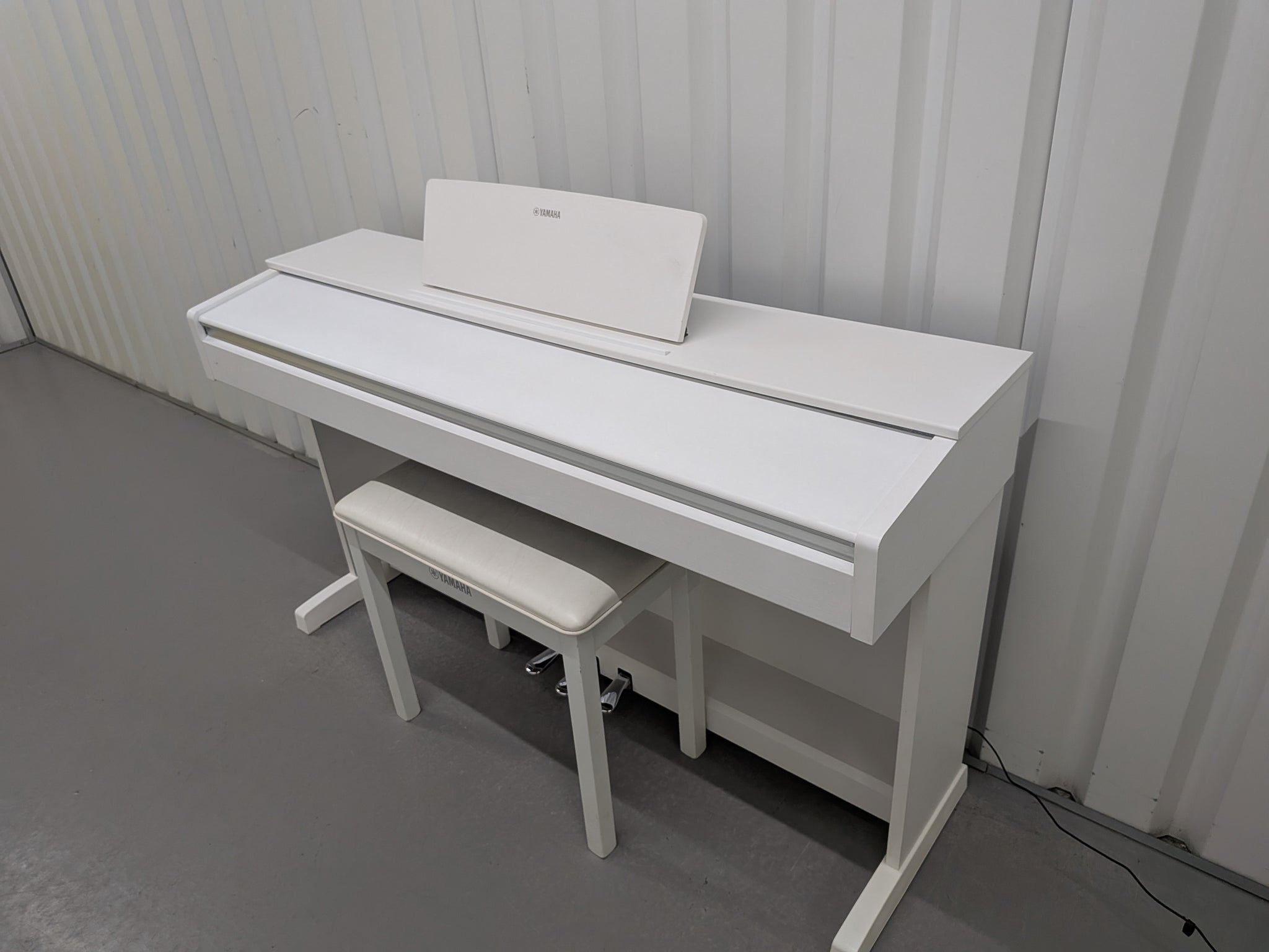 Yamaha Arius YDP-143 Digital Piano and stool in satin white finish