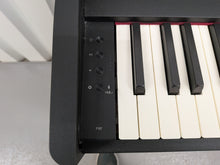 Load image into Gallery viewer, Roland F107 compact slim size Digital Bluetooth Piano in black  stock # 25455
