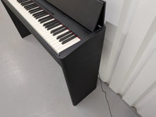 Load image into Gallery viewer, Roland F107 compact slim size Digital Bluetooth Piano in black  stock # 25455
