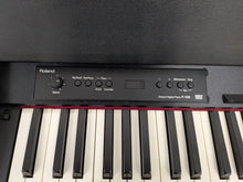 Load image into Gallery viewer, Roland F120R compact slim size Digital Piano in black finish stock # 25440
