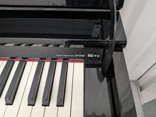 Load image into Gallery viewer, Roland DP-990r digital slim line space saving piano in polished ebony black stock # 25516

