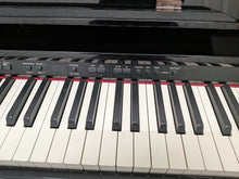Load image into Gallery viewer, Roland DP-990r digital slim line space saving piano in polished ebony black stock # 25516
