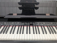 Load image into Gallery viewer, Roland DP-990r digital slim line space saving piano in polished ebony black stock # 25516
