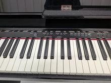 Load image into Gallery viewer, Roland DP-990r digital slim line space saving piano in polished ebony black stock # 25516
