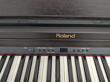 Load image into Gallery viewer, Roland RP301 digital piano and stool in dark rosewood finish stock number 25540
