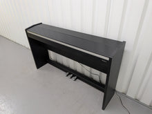 Load image into Gallery viewer, Roland F130R Digital Piano in black with matching colour stool stock # 25570
