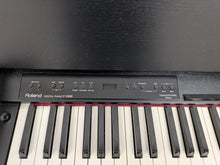 Load image into Gallery viewer, Roland F130R Digital Piano in black with matching colour stool stock # 25570
