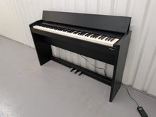 Load image into Gallery viewer, Roland F130R Digital Piano in black with matching colour stool stock # 25570
