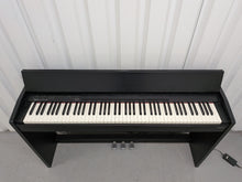 Load image into Gallery viewer, Roland F130R Digital Piano in black with matching colour stool stock # 25570
