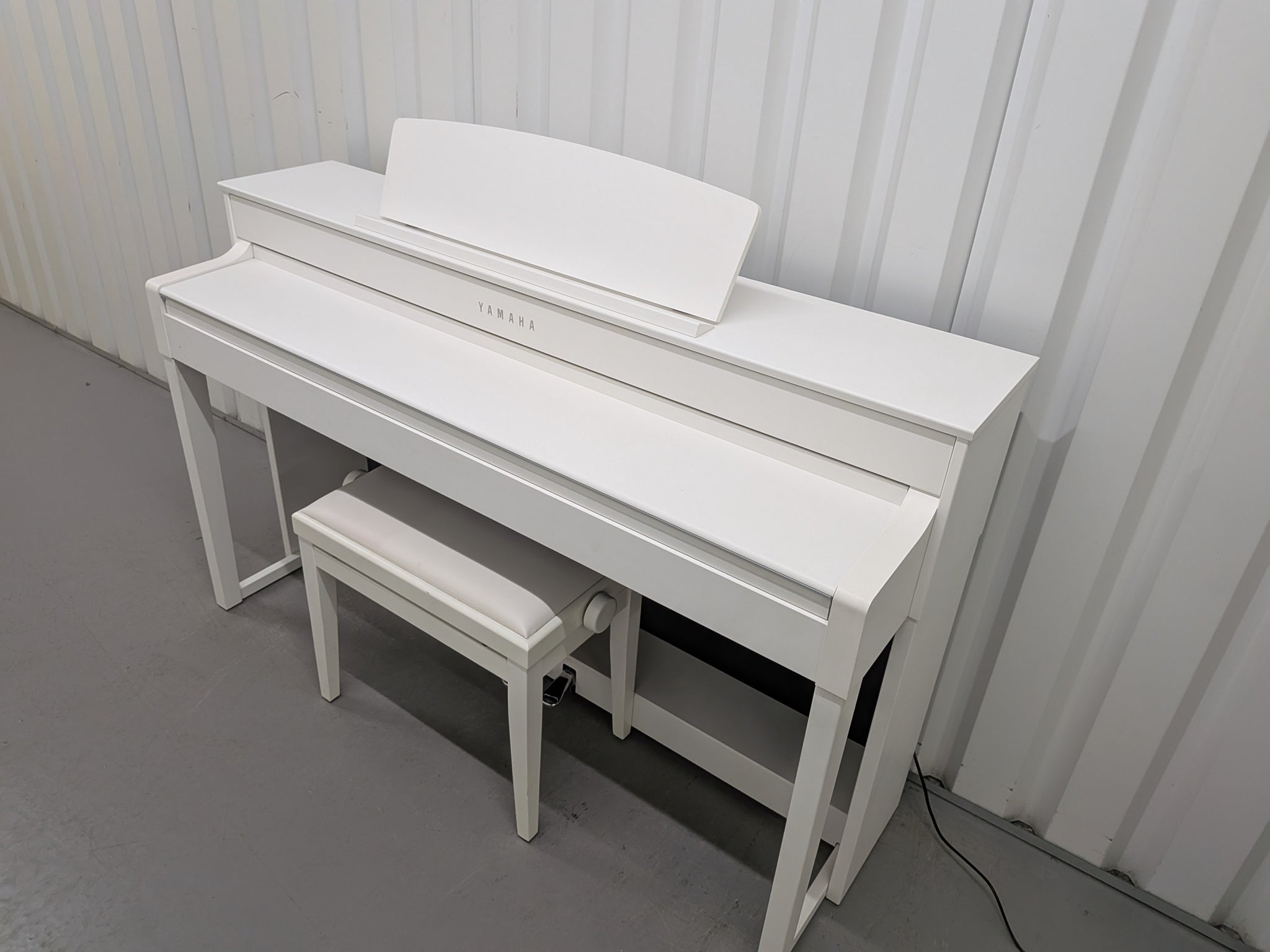 Yamaha Clavinova CLP-545 digital piano in satin white with stool