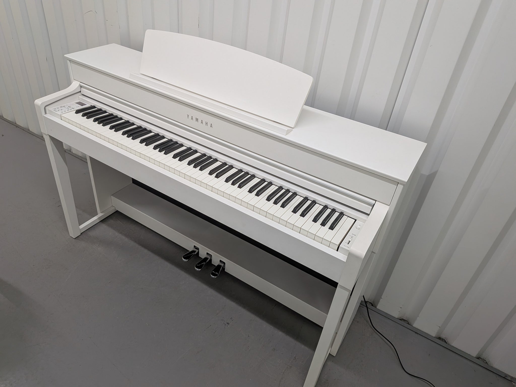 Yamaha Clavinova CLP-545 digital piano in satin white with stool