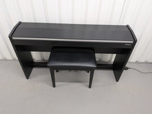 Load image into Gallery viewer, Roland F140R Digital Piano in satin black slim line space saver stock # 26052
