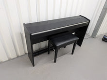 Load image into Gallery viewer, Roland F140R Digital Piano in satin black slim line space saver stock # 26052
