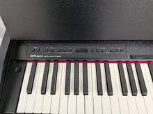 Load image into Gallery viewer, Roland F140R Digital Piano in satin black slim line space saver stock # 26052
