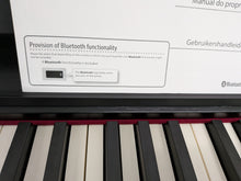 Load image into Gallery viewer, Roland F140R Digital Piano in satin black slim line space saver stock # 26052
