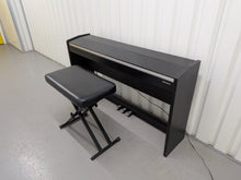 Load image into Gallery viewer, Roland F140R Digital Piano in satin black slim line space saver stock # 26060
