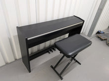 Load image into Gallery viewer, Roland F140R Digital Piano in satin black slim line space saver stock # 26060
