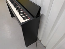 Load image into Gallery viewer, Roland F140R Digital Piano in satin black slim line space saver stock # 26060
