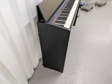 Load image into Gallery viewer, Roland F140R Digital Piano in satin black slim line space saver stock # 26060
